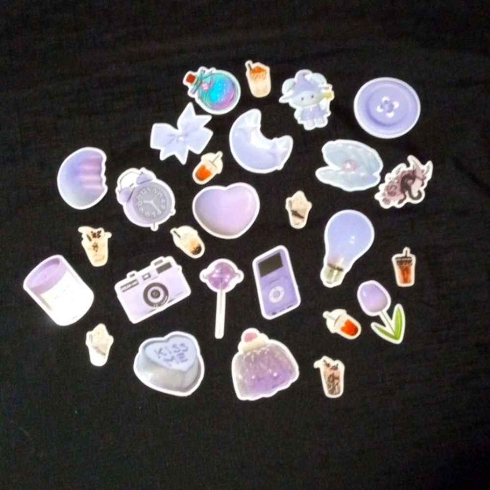 There are 27 stickers in the pack. The color theme is purple.